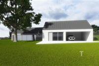 Moderní rodinný dům se zateplenou fasádou, velká garáž, prostorná zahrada a šikmá střecha v klidné lokalitě.